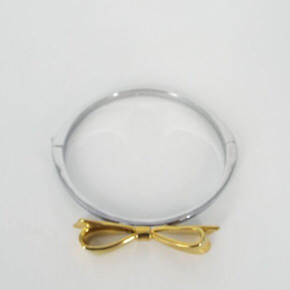 Kate Spade Silver and Gold Tone Bow Bangle Bracelet - Picture 1 of 7